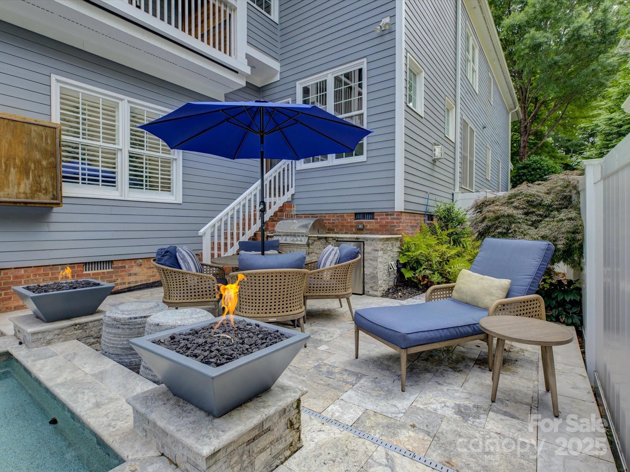628 Bracket Street Fort Mill, SC 29708 - Photo 44 of 48 a view of sitting area with furniture and umbrella