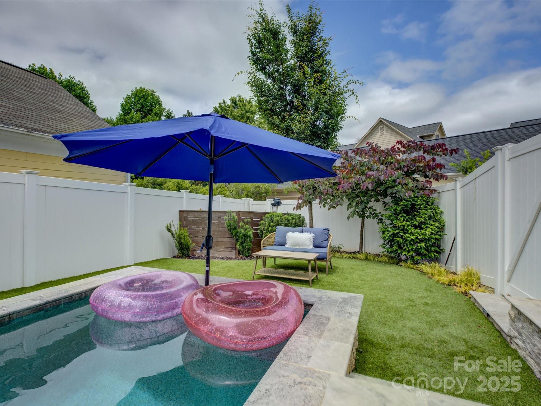 628 Bracket Street Fort Mill, SC 29708 - Photo 47 of 48 a view of a table and chairs under an umbrella