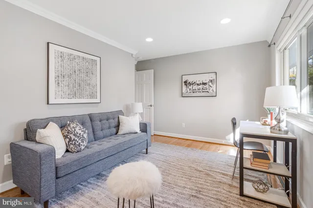 a spacious bathroom with a toilet sink and mirror