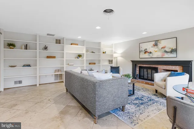 a bedroom with a bed and glass window