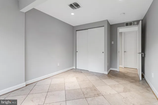a view of a patio with dining table and chairs with wooden floor and fence