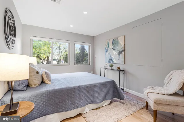 a view of a patio with table and chairs with wooden floor and fence