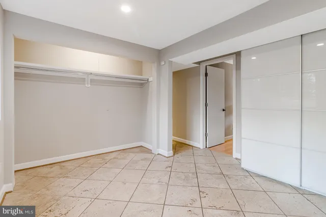 a view of a patio with table and chairs and wooden floor
