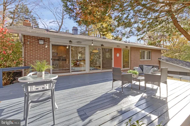 a view of house with outdoor space and trees