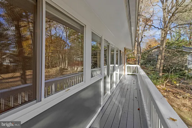 a living room with furniture a table and a fireplace