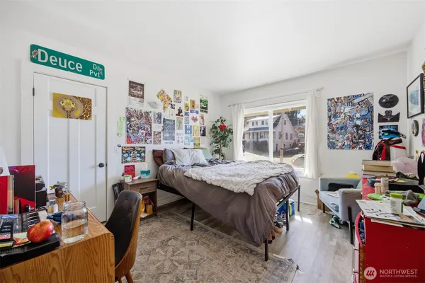 a bed room with a bed and a desk