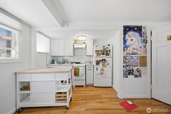 a view of workspace with window and cabinet