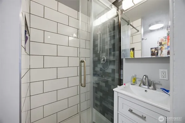 a bathroom with a sink and a shower