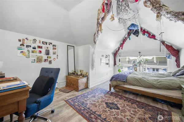 a bedroom with a bed and a couch