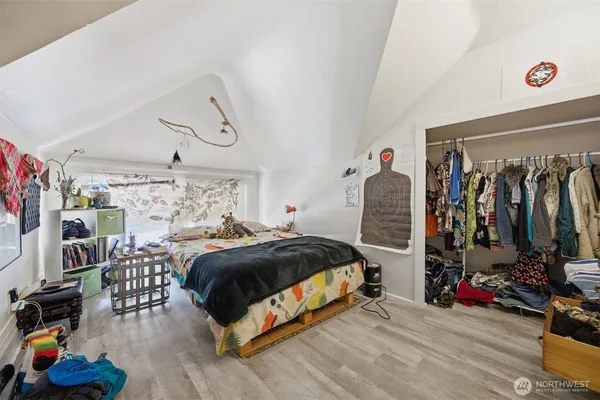 a bedroom with bed and a window