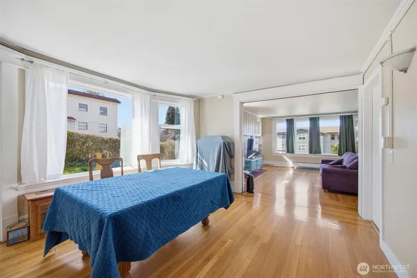 a view of a dining room with furniture window and wooden floor