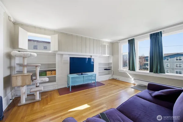 a living room with furniture and a flat screen tv