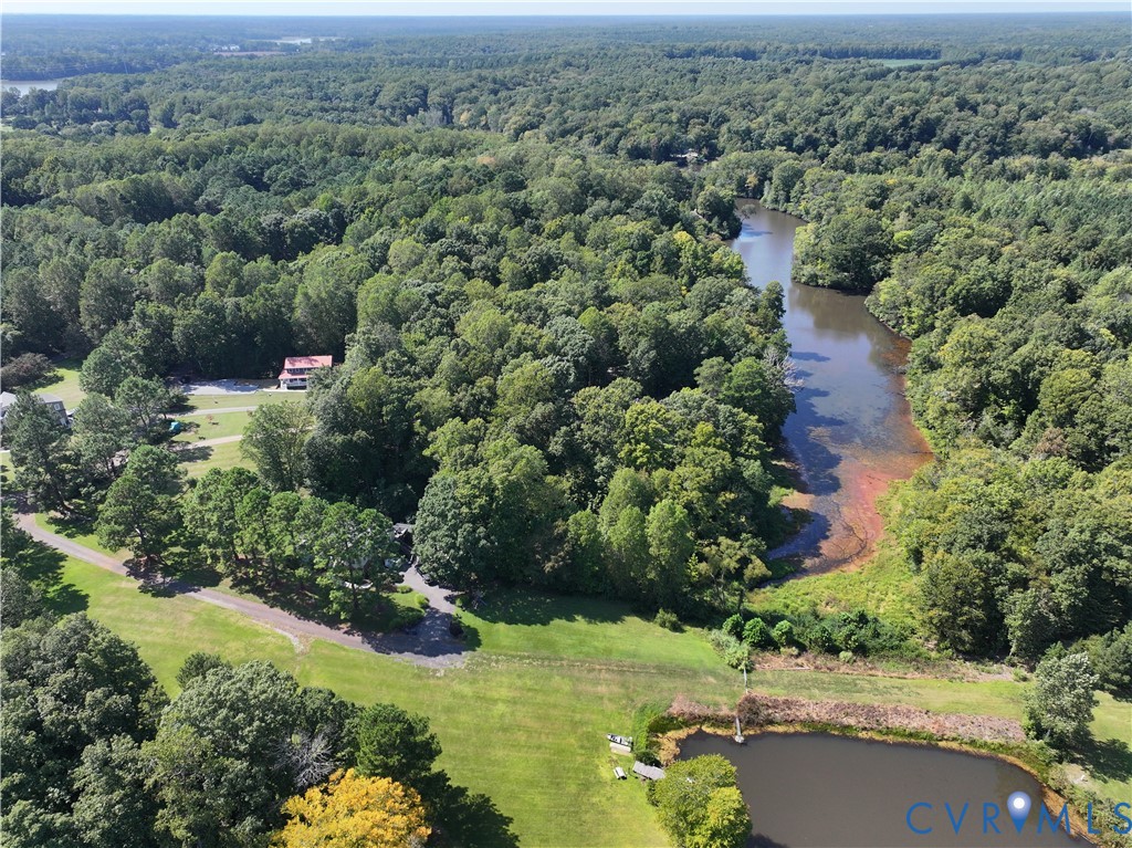 80 Mill Ridge Road Hartfield, VA 23071 - Photo 47 of 50 Wooded property with water frontage, featuring a b