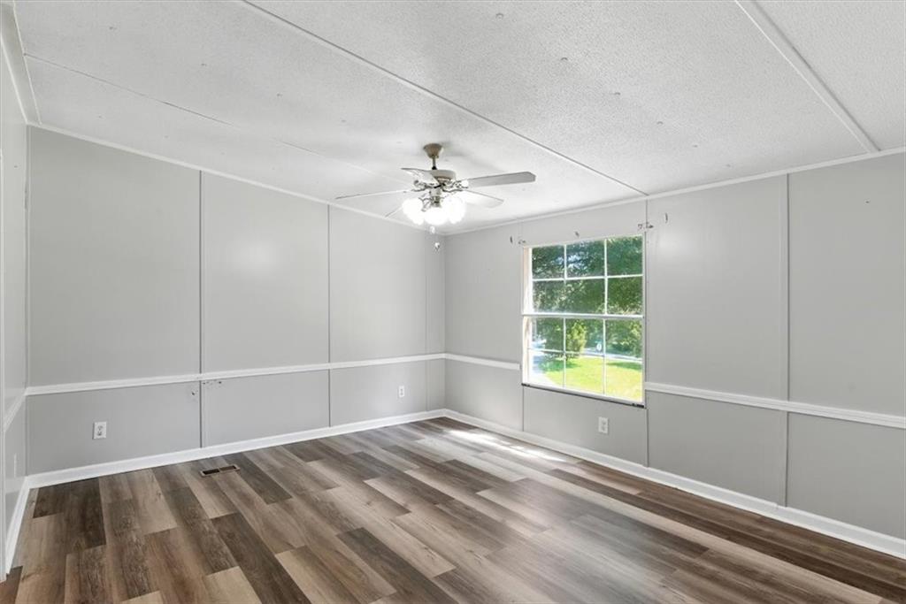71 Kirk Road Northwest White, GA 30184 - Photo 13 of 74 a view of an empty room with a window
