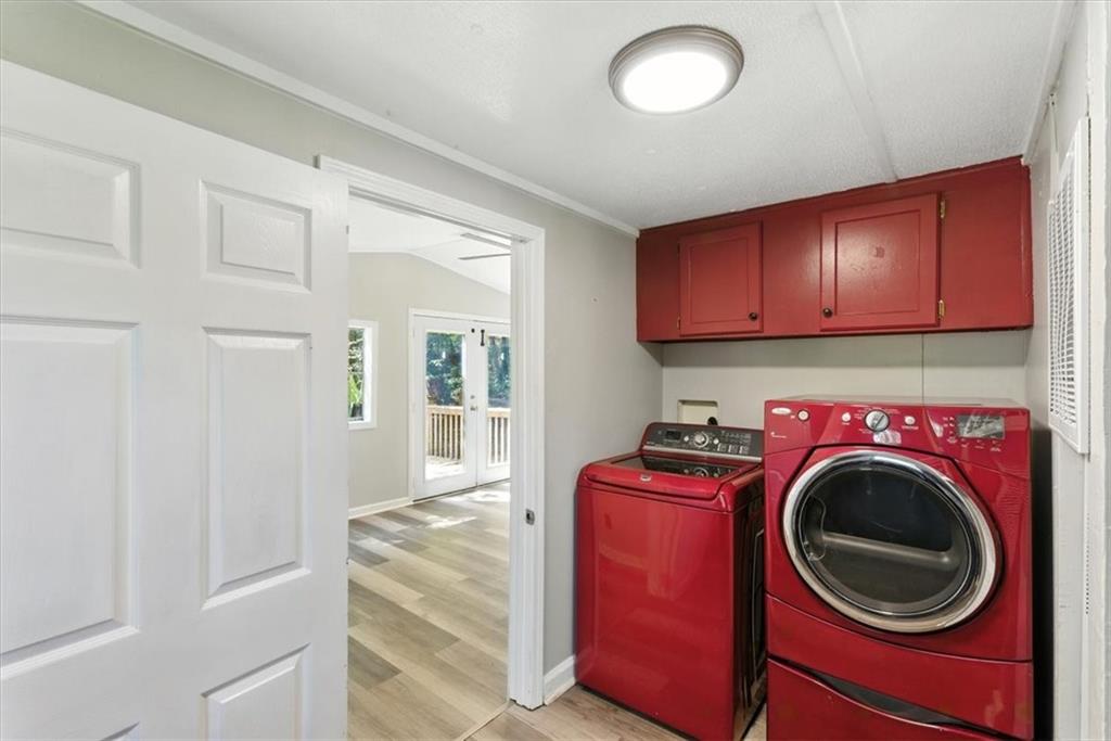 71 Kirk Road Northwest White, GA 30184 - Photo 24 of 74 a utility room with sink dryer and washer