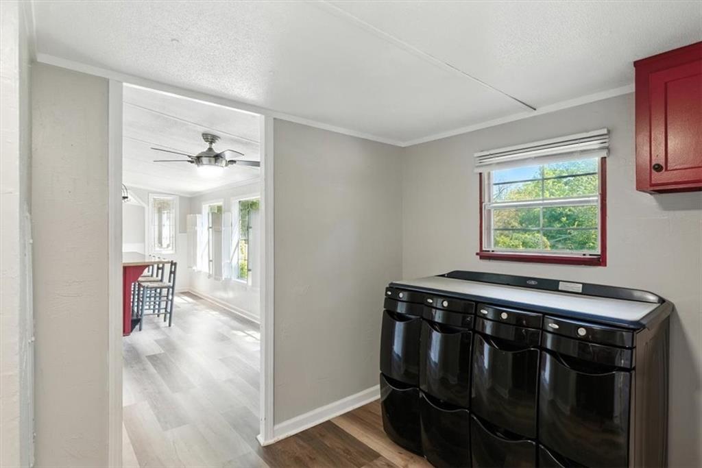 71 Kirk Road Northwest White, GA 30184 - Photo 25 of 74 a view of a hallway with windows and chandelier