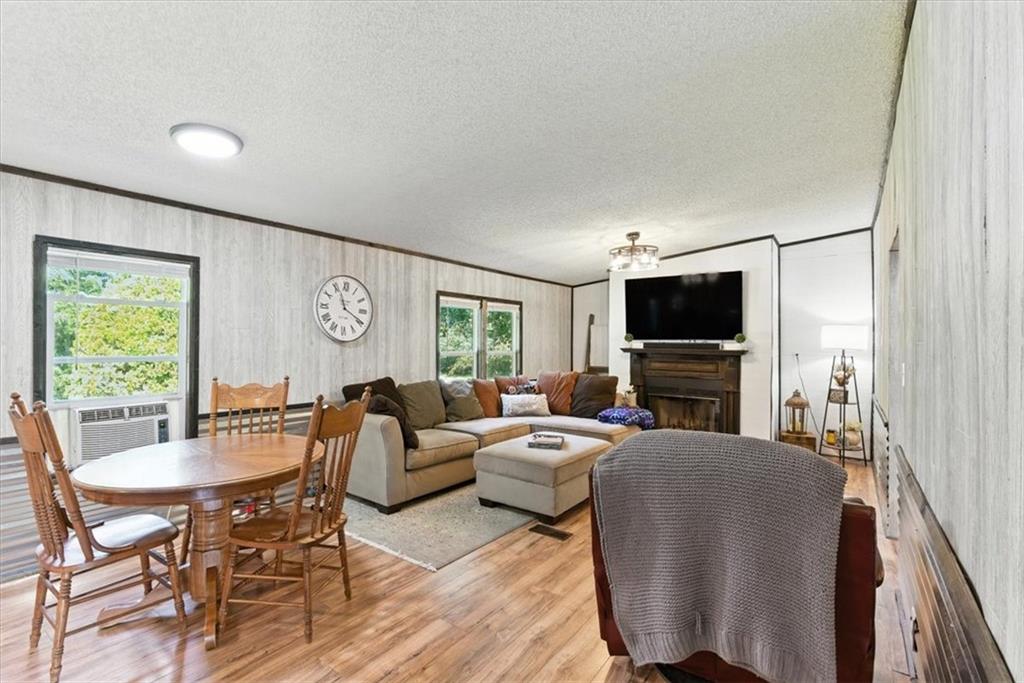71 Kirk Road Northwest White, GA 30184 - Photo 38 of 74 a living room with furniture a flat screen tv and a window