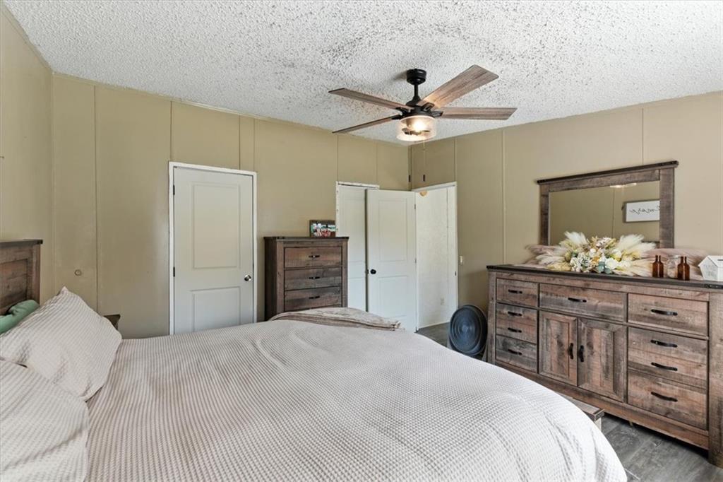 71 Kirk Road Northwest White, GA 30184 - Photo 46 of 74 a bedroom with a bed and a dresser