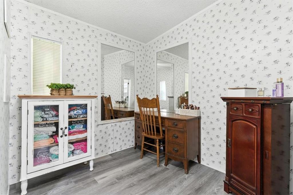 71 Kirk Road Northwest White, GA 30184 - Photo 50 of 74 a bed room with a bed and a book shelf