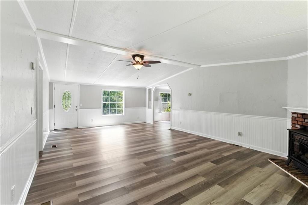 71 Kirk Road Northwest White, GA 30184 - Photo 6 of 74 wooden floor in an empty room with a window