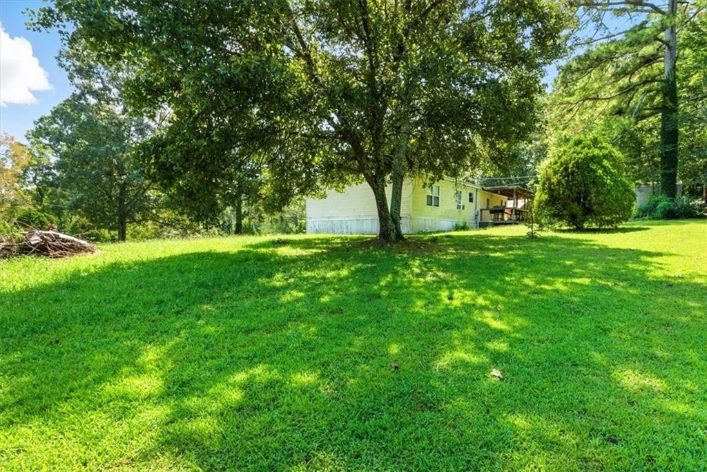 71 Kirk Road Northwest White, GA 30184 - Photo 64 of 74 a view of a trees with a big yard
