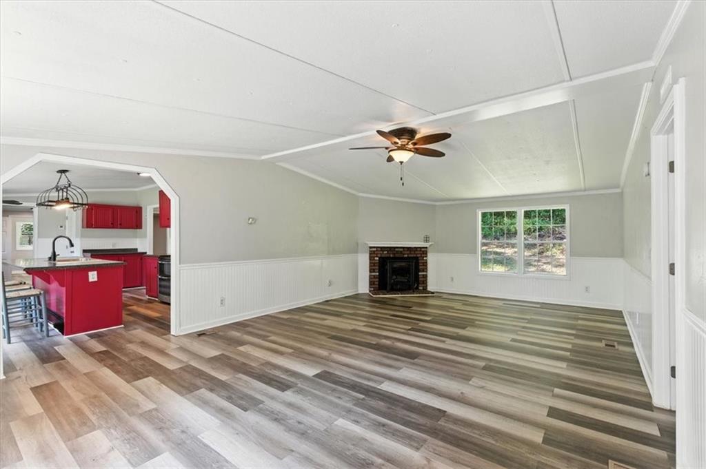 71 Kirk Road Northwest White, GA 30184 - Photo 7 of 74 a view of an empty room with a fireplace and a window