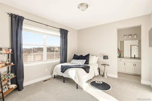 a living room with furniture a table and a large window
