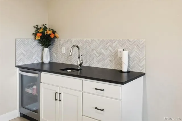 a vase of flowers sitting on a shelf