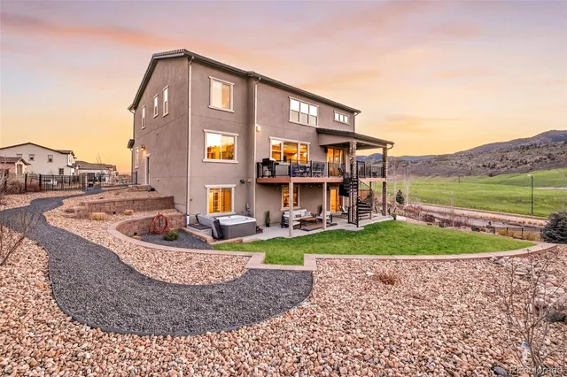 a view of a big house with a yard