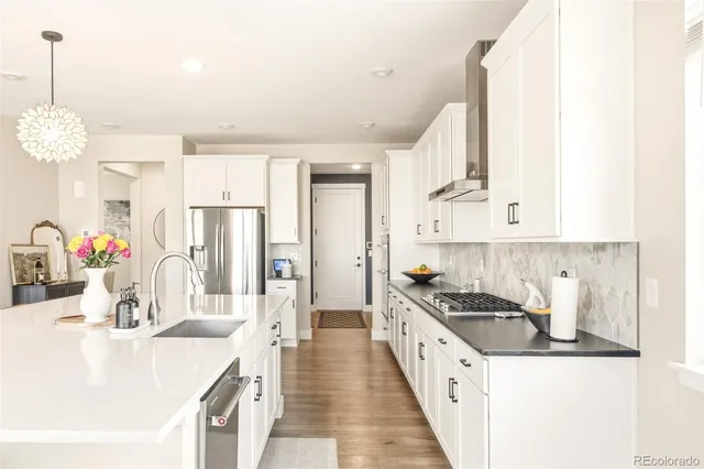 a open kitchen with stainless steel appliances granite countertop a sink and cabinets
