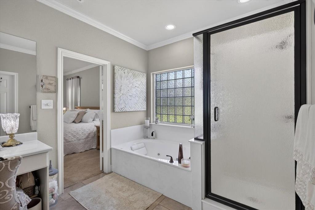 111 Trailwood Road Enchanted Oaks, TX 75156 - Photo 18 of 33 a bathroom with a tub and shower