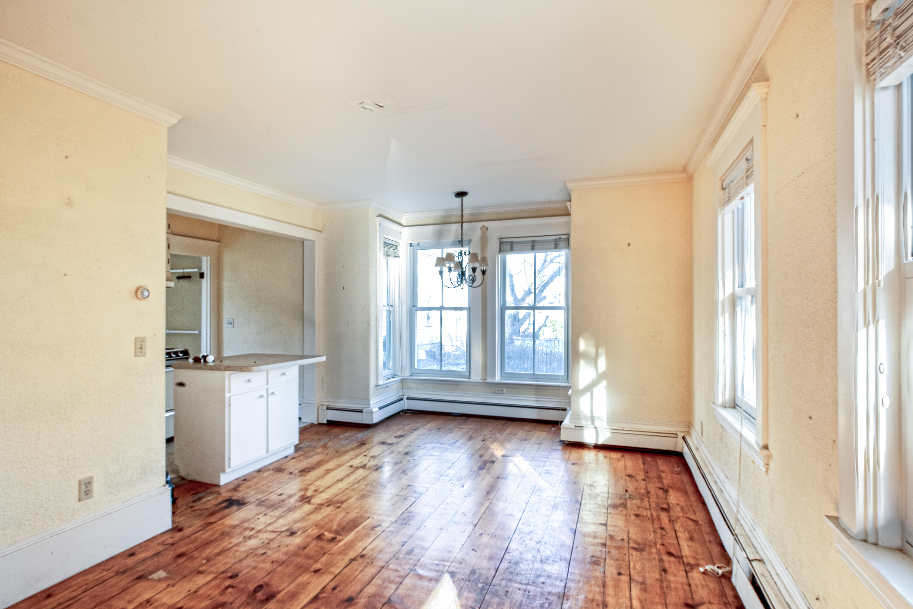 6 Bangs Street Provincetown, MA 02657 - Photo 13 of 36 a view of an empty room with wooden floor and a window