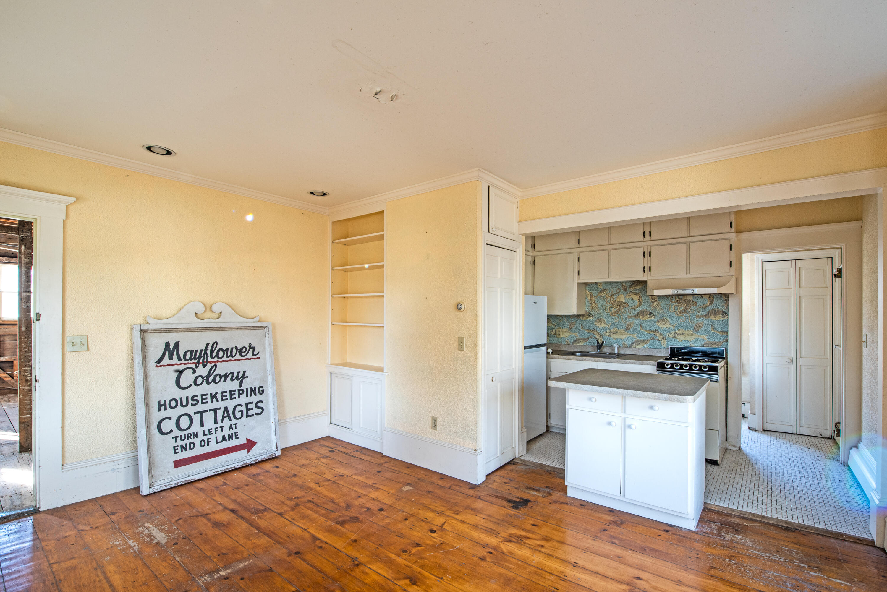 6 Bangs Street Provincetown, MA 02657 - Photo 14 of 36 a view of a kitchen with a sink and dishwasher with wooden floor