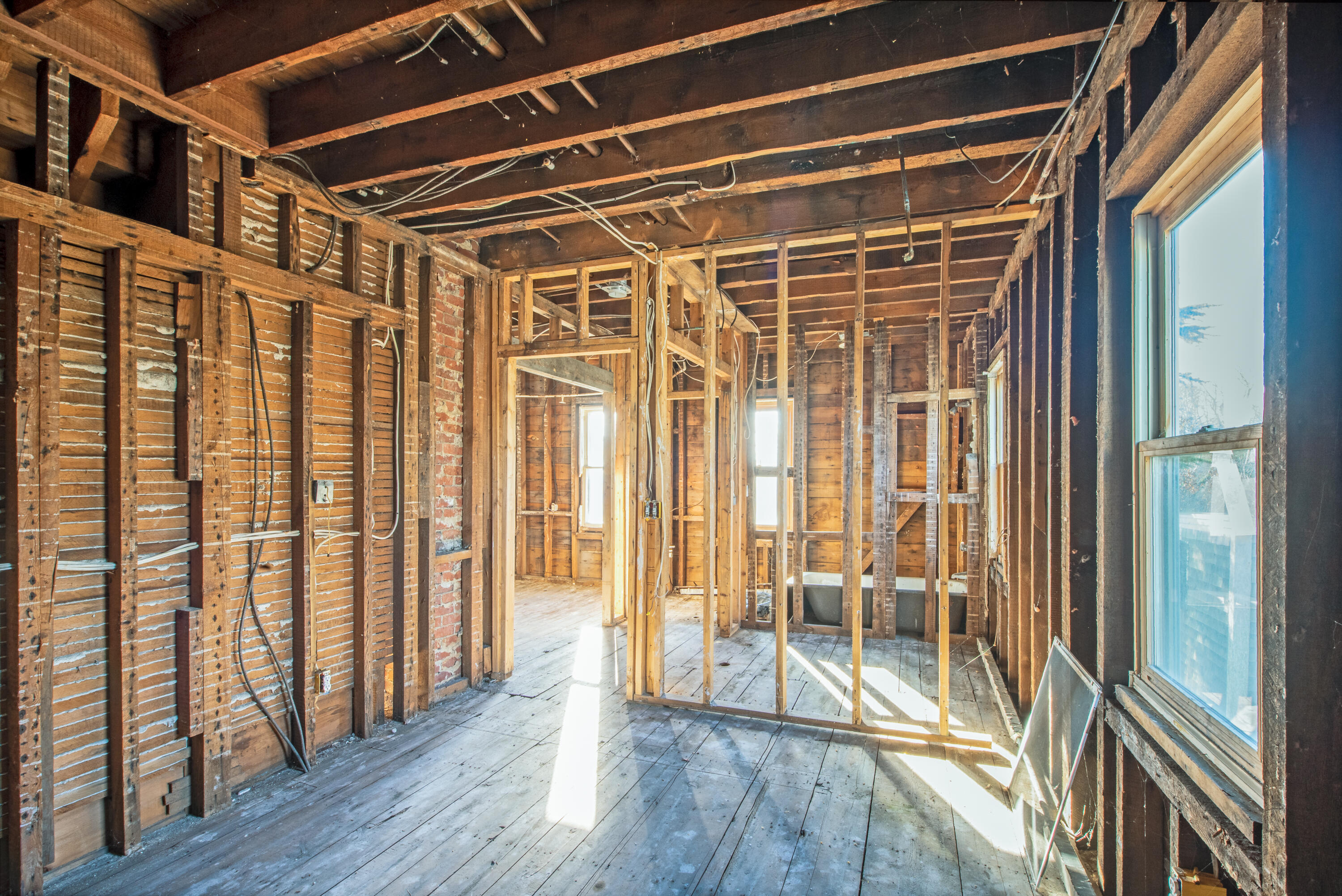6 Bangs Street Provincetown, MA 02657 - Photo 17 of 36 a view of an empty room with wooden floor and a window