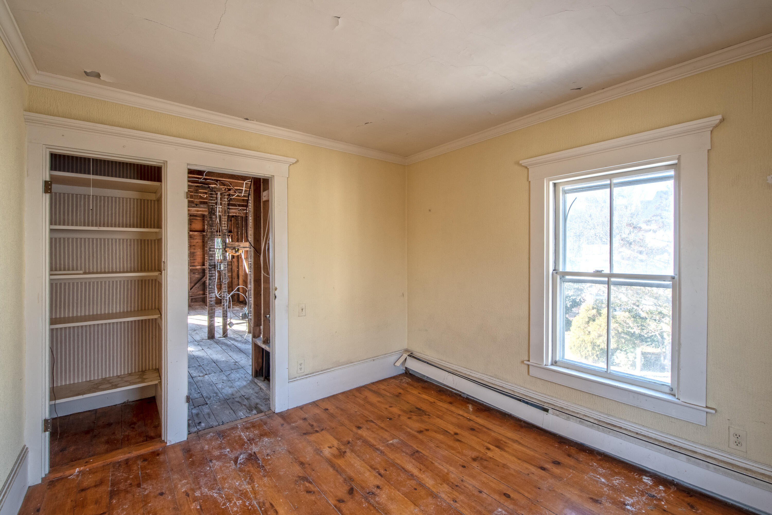 6 Bangs Street Provincetown, MA 02657 - Photo 29 of 36 a view of an empty room with a window and wooden floor