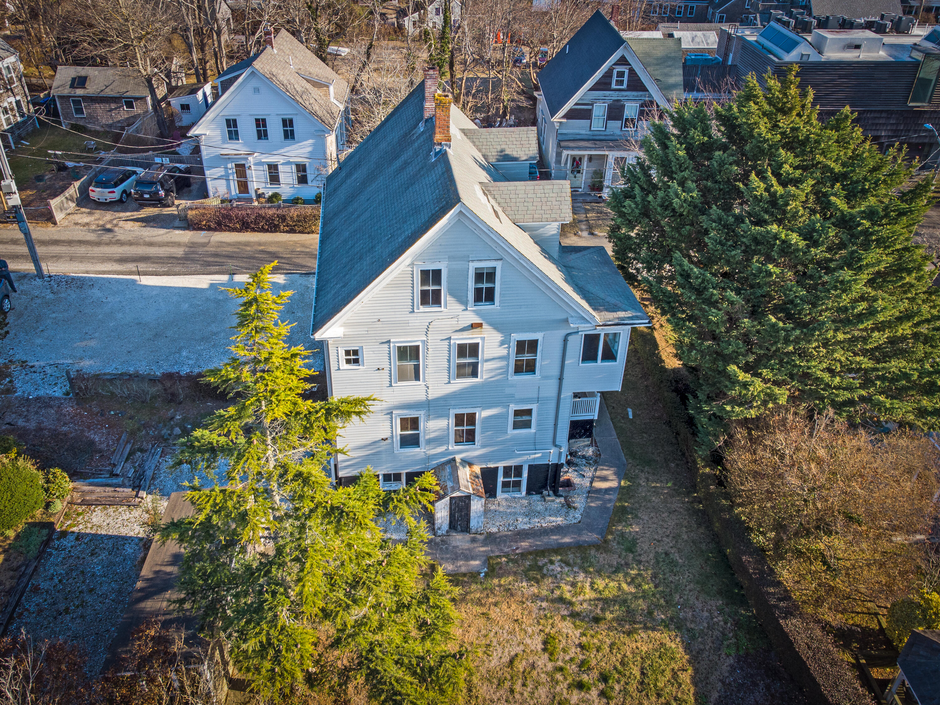 6 Bangs Street Provincetown, MA 02657 - Photo 5 of 36 a aerial view of a house with a big yard plants and large trees