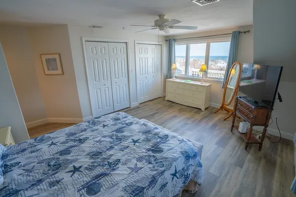 a view of a livingroom with furniture and a window