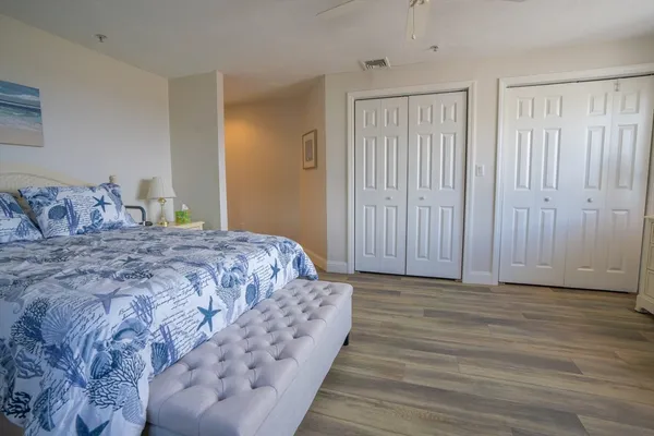 a bedroom with a bed and a closet