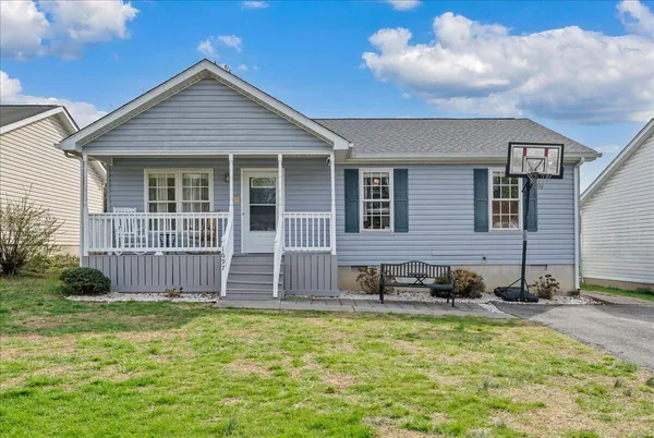 a front view of a house with a yard