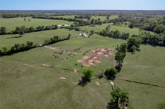 an aerial view of a golf course with parking space