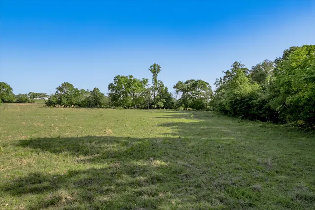 a view of a lake with a yard