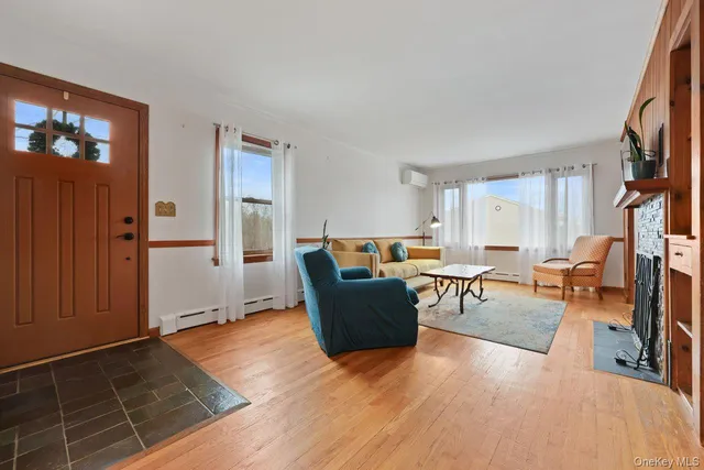 a living room with furniture and a window