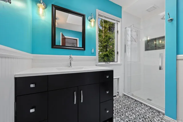a bathroom with a sink and a mirror