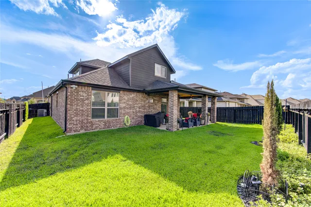 a view of a house with a yard porch and sitting area