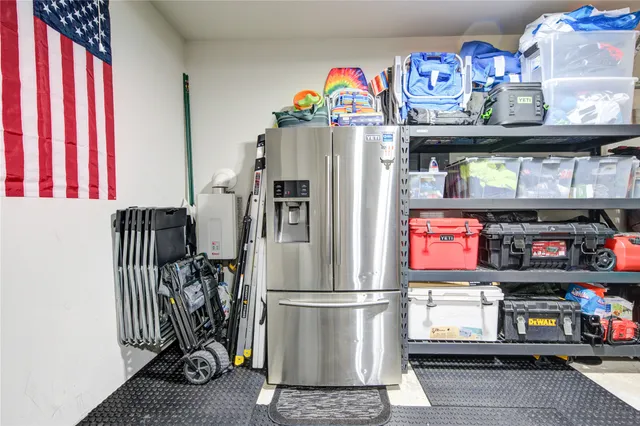 a kitchen with stainless steel appliances a refrigerator and a stove