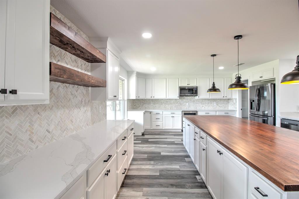3884 Lois Road East Sanger, TX 76266 - Photo 15 of 40 Never run out of Space in the kitchen, lots of counter space and plenty of cabinets!