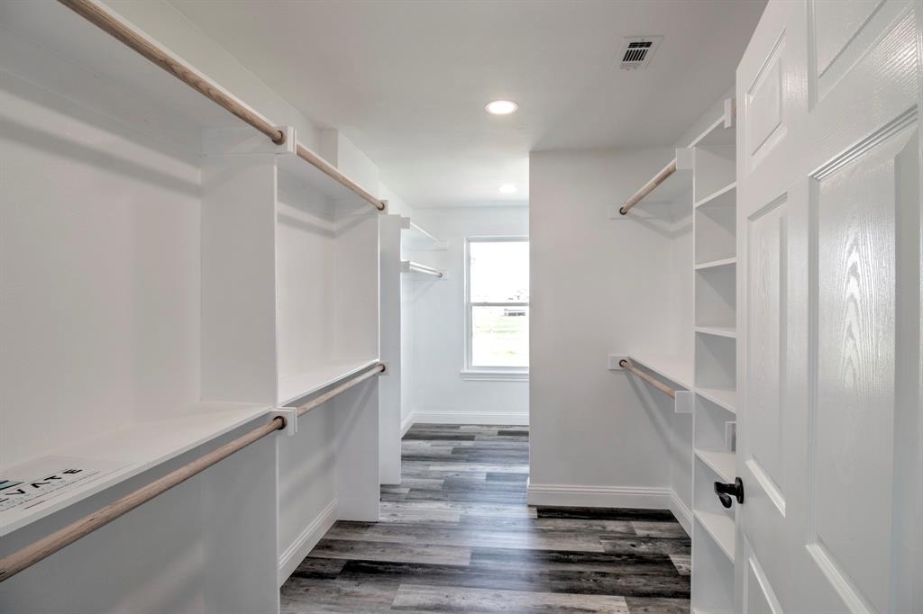 3884 Lois Road East Sanger, TX 76266 - Photo 32 of 40 Large Primary walk in closet with built in shelving!