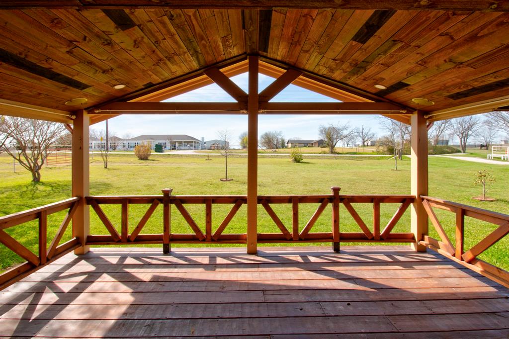 3884 Lois Road East Sanger, TX 76266 - Photo 6 of 40 Deck off the front porch, perfect space for a porch swing, enjoy the scenery while you drink your morning coffee!
