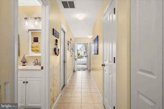 a kitchen with stainless steel appliances granite countertop a refrigerator a stove a sink and a refrigerator