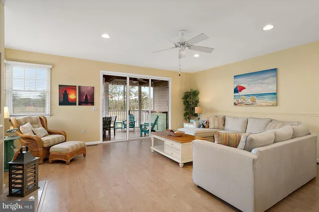 a kitchen with granite countertop white cabinets and stainless steel appliances